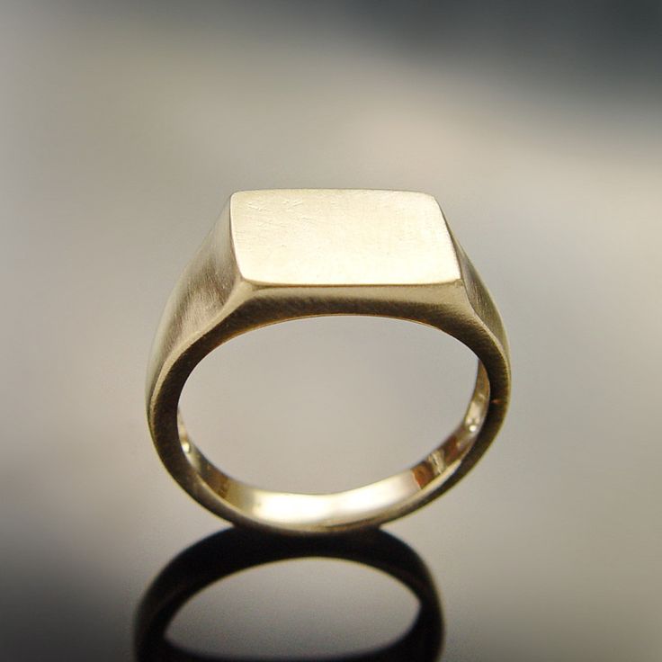 "Classic signet ring made of Matte 14K Gold that looks perfect on the finger. You can order this ring made of rose, yellow or white gold. Options are available when checking out. Given that our jewelry is handmade especially for you, please consider that color variations and slight variances are normal. All items are packaged in an eco-friendly gift wrap ready for gifting. Construction & Dimensions: 14K Gold approximately width 10 mm (0.4\") All our jewelry can be made of 18K gold as well. P Modern Rose Gold Signet Ring With Polished Finish, Minimalist Rose Gold Signet Ring With Polished Finish, Minimalist Rose Gold Polished Signet Ring, Minimalist White Gold Signet Ring For Anniversary, Modern Rose Gold Signet Ring With Round Band, Minimalist Rose Gold Signet Ring For Formal Occasions, Modern Rings With Classic Design For Gift, Rose Gold Polished Finish Open Signet Ring, Rose Gold Polished Open Signet Ring