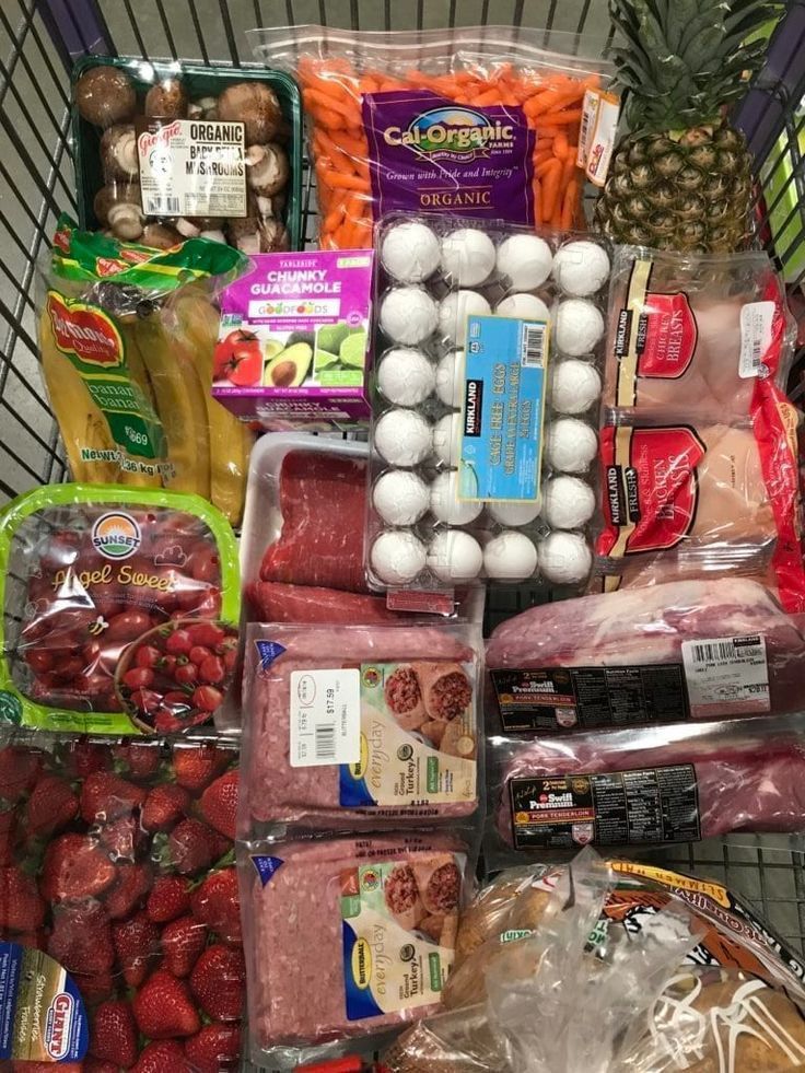 a shopping cart filled with lots of food