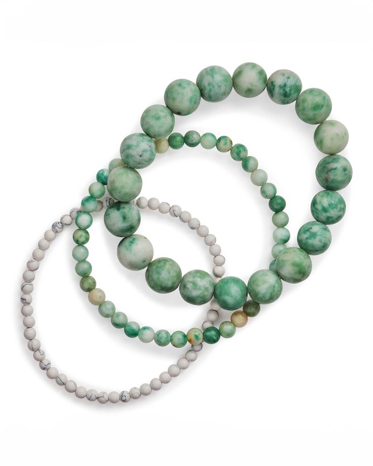 Enhance your style with our Natural Jade & White Howlite Stretch Bracelet Set of 3. Crafted with two jade beaded bracelets and one white howlite bracelet, this set exudes elegance and sophistication. The jade beads promote balance and harmony, while the white howlite promotes calmness and stress relief. Elevate your look with this luxurious bracelet set. Materials: Genuine Stone, Elastic Cord Features: measures: 7" length, 3/4/10mm genuine stone beads, Stretch bracelet - one size fits most White Adjustable Jade Bracelets, Hand-strung White Jade Beaded Bracelets, Adjustable White Jade Beaded Bracelets, White Jade Jewelry With 8mm Beads, White Jade Beaded Bracelets With 8mm Beads, White Jade Bracelets With Round Beads, Luxurious Bracelet, Howlite Bracelet, Balance And Harmony