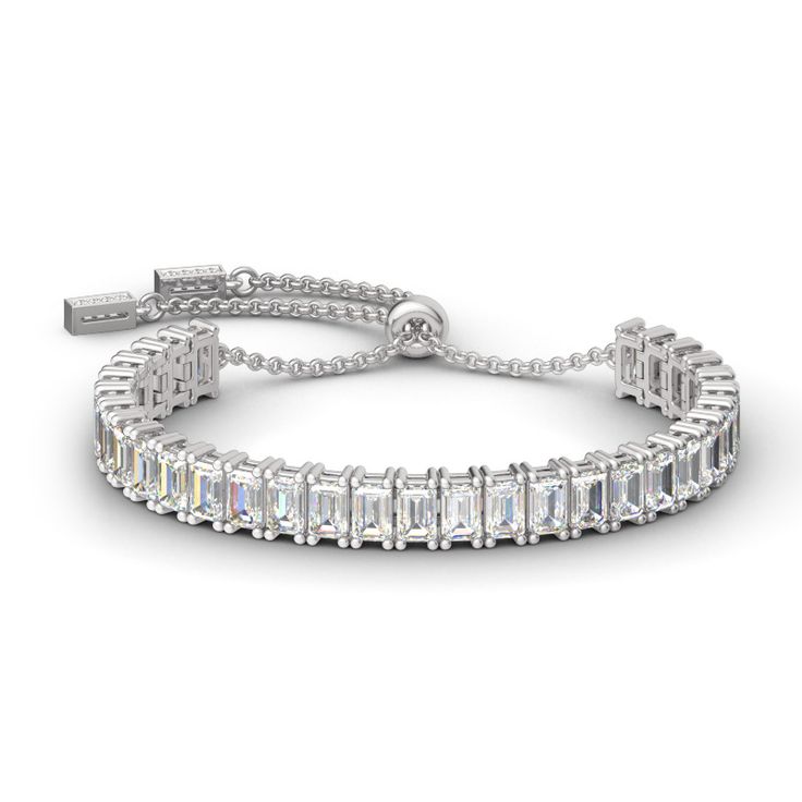 Illuminate her wrist with the lavish look of this gleaming sterling silver adjustable tennis bracelet. A row of emerald stones radiate optimal shimmer. Uniquely designed, each shimmering stone is set to appear extra large and more brilliant, creating twice the sparkle. Held together with a bolo clasp, this bracelet is a chic mix of glamour and elegance.Width: 5.6 mmHeight: 7.4 mmThickness: 4.1 mmMaterial: 925 SilverStone Type: Jeulia® StonePlating Color: SilverBracelet Size: 250 mm Opal Cuff Bracelet, Jewelry Knowledge, Sterling Silver Rings Set, Silver Ring Set, Jewelry Fashion Trends, Bracelet Online, Jewelry Outfit, Classic Jewelry, Emerald Cut Diamonds