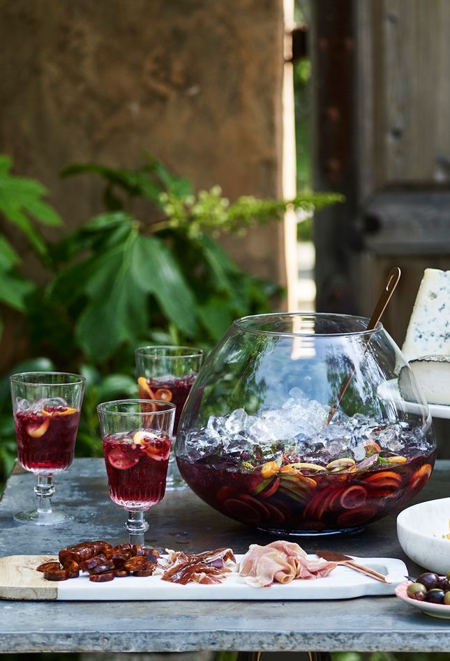 a table topped with plates and glasses filled with food