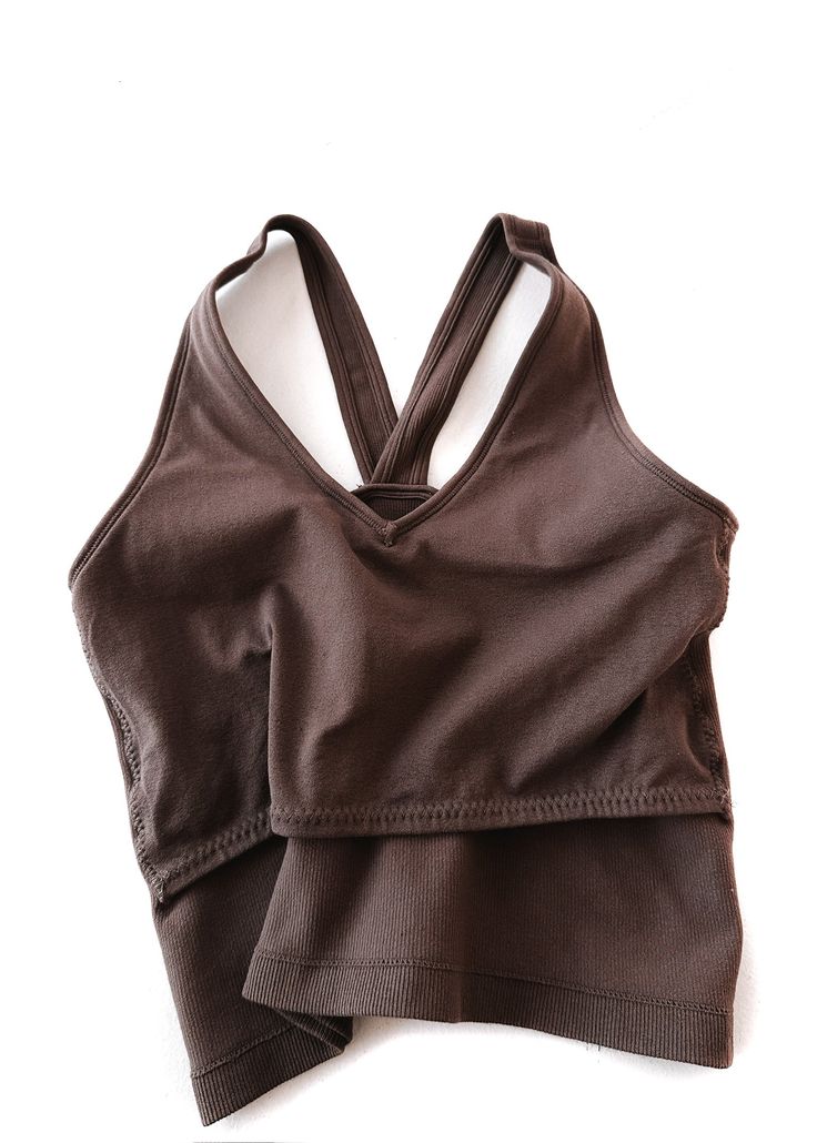 This brami is our longest style yet! The perfect combination of brami and tank with even more versatility. It's easy to wear, incredible for our long-torso girlies who need a little more length, and back smoothing. If you're looking to feel cute and comfy at the same time, this checks all the boxes! Works like a bra, fits like a tank. Built-in Extra Lining for Chest Support Fits True to Size Body-Hugging Fit and Structured Form so You Can Wear Less Layers and Still Feel Supported Longer Length V-Neck Neckline V-Neck Back so the Straps Don't Slip or Move Over Shoulders Lightly Ribbed Stretchy Nylon/Spandex Blend Anti-itch Tag Shown Styled with Accessories from our Shop Bramis are Considered a Sensitive Item and are Not Eligible for Return or Exchange Pebby's Measurements: 5ft. 4in. 8/10 in V-neck Top With Built-in Bra For Everyday, Everyday V-neck Top With Built-in Bra, Stretch Camisole Tops For Relaxation, Stretch Camisole Tops For Casual Wear, Relaxation Camisole Top With Built-in Bra, Fitted Tops With Built-in Bra For Relaxation, Supportive Solid Tank Top For Summer, Supportive Tank Top For Summer, Supportive Fit Tank Top For Summer