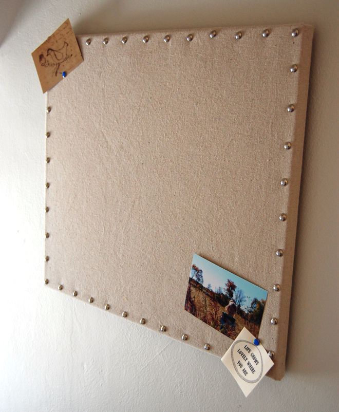 a bulletin board with some pictures pinned to it