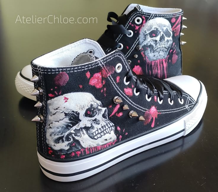 Hand-painted skulls dripping with blood Hand-screwed metal studs (8 pieces per shoe) You will get two additional studs. Additional Black satin laces as a gift for each customer (120-130 cm.) The pattern is painted on very good quality sneakers from the Polish company BIG STAR                  producing shoes and clothes. The design is found on one side of each shoe - on the outside and on the vertical bar on the back. I am happy to accept custom orders- feel free to contact me if you prefer something else. If you know your shoe number in US sizing, use the conversion chart to see what it is in EU:  SIZE CONVERSION CHARTS - http://bit.ly/2n1MeN5  The sizing of BIG STAR brand sneakers corresponds to the sizing of UNBRANDED shoes in the conversion chart. PLEASE CHOOSE THE SIZE WISELY BEFORE Y Converse With Spikes, Black Custom Sneakers With Spikes For Streetwear, Converse Shoe Art, Goth Converse, Shoe Customization Ideas, Skull Converse, Paint On Shoes, Art On Shoes, Spike Boots