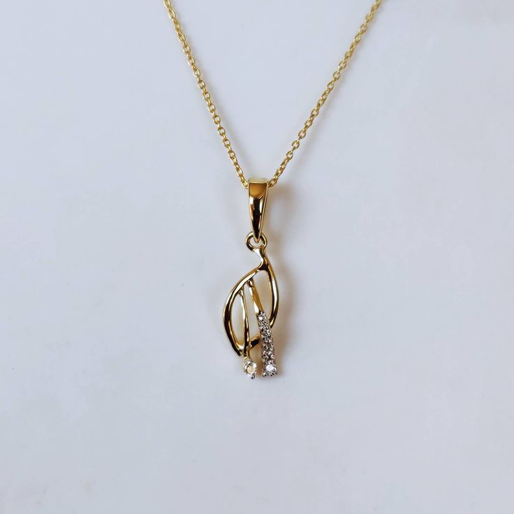 This is an exquisite diamond pendant set in 14K Solid Gold. An elegant design, perfect for regular wear featuring close set sparkling diamonds. ITEM DETAILS: ✓ Gold Kt: 14K Yellow Gold ✓ Gold Weight: 0.87 grams ✓ Pendant Size: 15x6mm ✓ Diamond Shape/ Cut: Round Brilliant ✓ Diamond weight: 0.05 carats ✓ Diamond No.: 7 Natural Diamonds ✓ Diamond Color: I-J ✓ Diamond Clarity: SI >>The Gold purity is guaranteed and it comes with authentic 14K gold hallmark. >>Jewlery Report provided as well certifie Diamond White American Diamond Necklace, Elegant Diamond Pendant Necklaces, Elegant Fine Jewelry Diamond Necklace For Gift, Necklaces With Diamond Accents In Cubic Zirconia, American Diamond Necklaces With Diamond Accents, Diamond White Hand Set Diamond Necklace Gift, Gold Diamond Necklace With Flower Pendant, Elegant Pendant Diamond Necklace For Gift, Hand-set White Gold Diamond Necklace As Gift