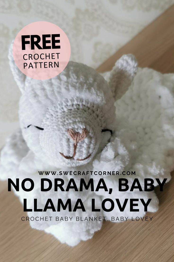 a white crocheted stuffed animal with the words no drama baby llama lovey below it