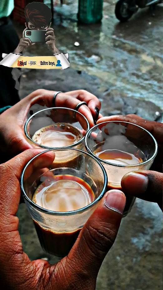 three people holding glasses with liquid in them