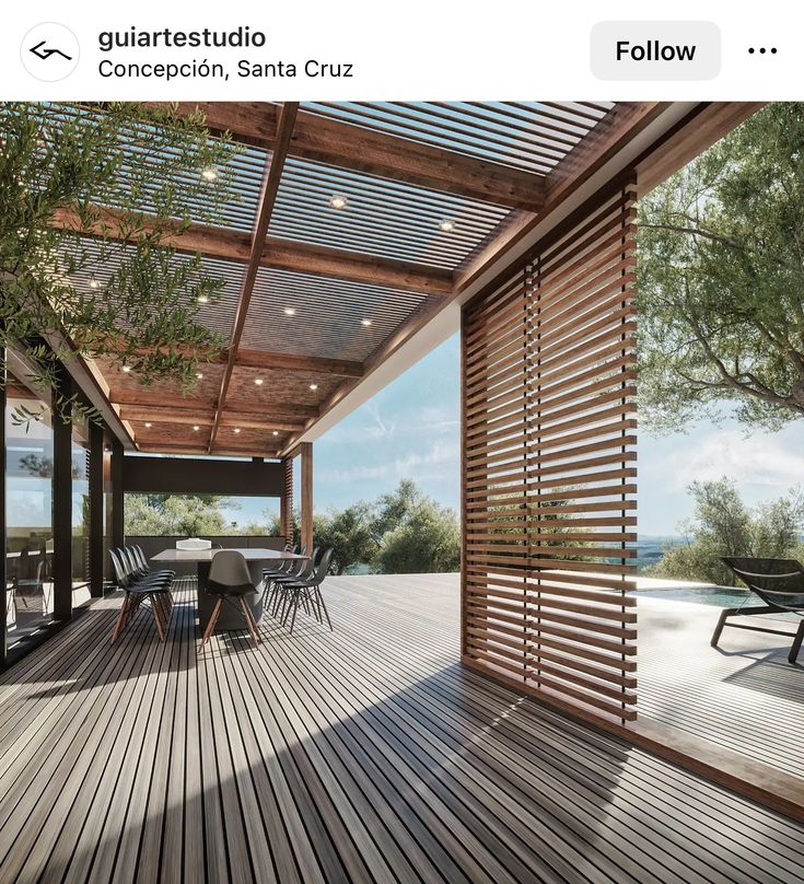 an outdoor patio with wooden flooring and louvered screens on the side of it