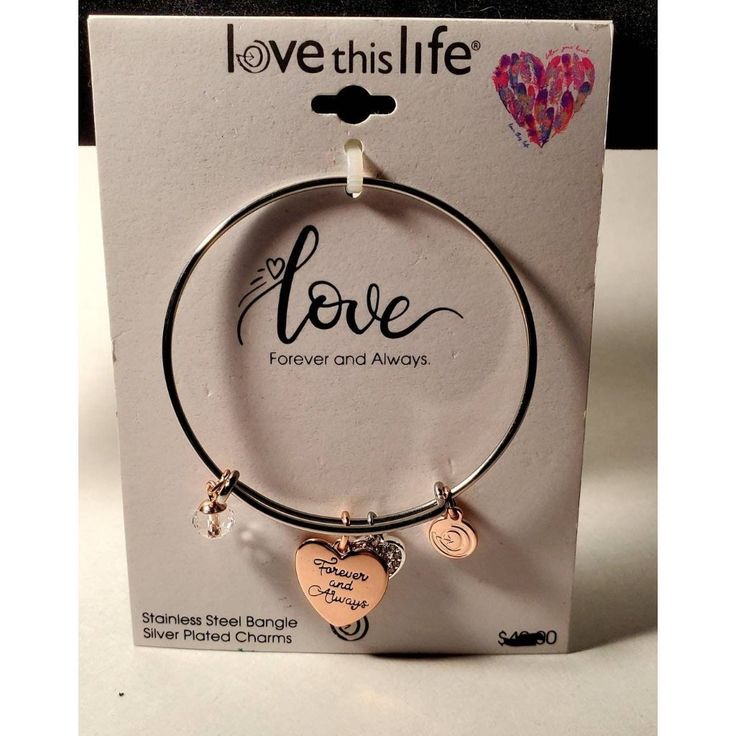 Love This Life Bracelet, Charm Bracelet, Stainless Steel Bangle With Silver Plated Charms. Classic, Stylish And Fun To Wear! Still In Its Original Packaging. Shipping Policy: Items Are Generally Shipped Usps Priority Mail Which Includes A Minimum Of $50 Insurance. All Items Are Carefully Packaged. If An Item Is Damaged During Shipping, Please Take Pictures And Let Me Know Immediately So A Claim Can Be Filed With The Shipper. I Have A Handling Fee That Helps Offset The Bubble Wrap, Peanuts And Other Packaging Materials I Use As I Don't Want Any Accidents. Thus Far, Everything Has Arrived In Beautiful Condition And I Would Like To Keep That Trend Going. If You Want To Purchase Multiple Items Silver Heart Bracelet For Best Friend On Valentine's Day, Silver Heart Bracelets For Best Friend Gift, Heart-shaped Silver Bracelets For Best Friend Gift, Silver Heart Bracelet For Best Friend On Mother's Day, Silver Bracelets For Best Friend Gift On Mother's Day, Metal Bracelets For Best Friend Gift On Mother's Day, Metal Bracelets For Best Friend And Mother's Day, Silver Heart-shaped Name Bracelet For Friendship, Metal Bracelets For Mother's Day