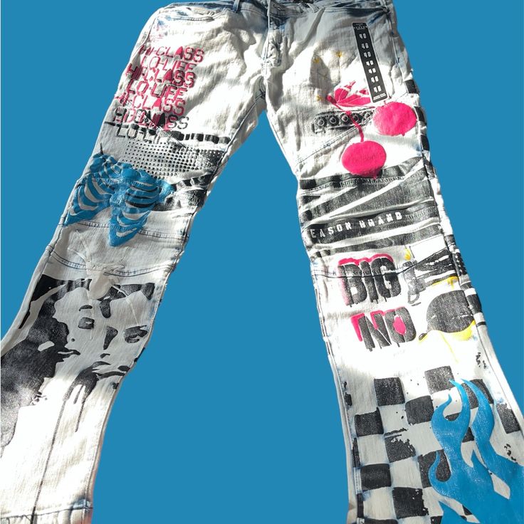 Mens Jeans With Graphics Highlighting Urban Philosophy And Artistry. Made By Reason Clothing. All-Over Print Denim Jeans. Sew In Patches, Incredible Attention To Detail. Runs Small, Size Up. Material: 98% Cotton 2% Spandex Style: Fly Button And Zipper Inseam Length: 32” Rise: 10.5” Pockets: 5 Pocket Design Care: Machine Wash Cold Inside Out & Tumble Dry Product Type : Jeans Special Tag : Casual Waist: 40” With No Stretch Casual White Bottoms With Graffiti Print, Casual Cotton Jeans With Graffiti Print, Urban Cotton Bottoms With Graffiti Print, Fitted Cotton Jeans With Graphic Print, Fitted Graphic Print Cotton Jeans, Blue Casual Bottoms With Graffiti Print, Casual Blue Bottoms With Graffiti Print, White Cotton Jeans With Graphic Print, Blue Cotton Jeans With Graphic Print