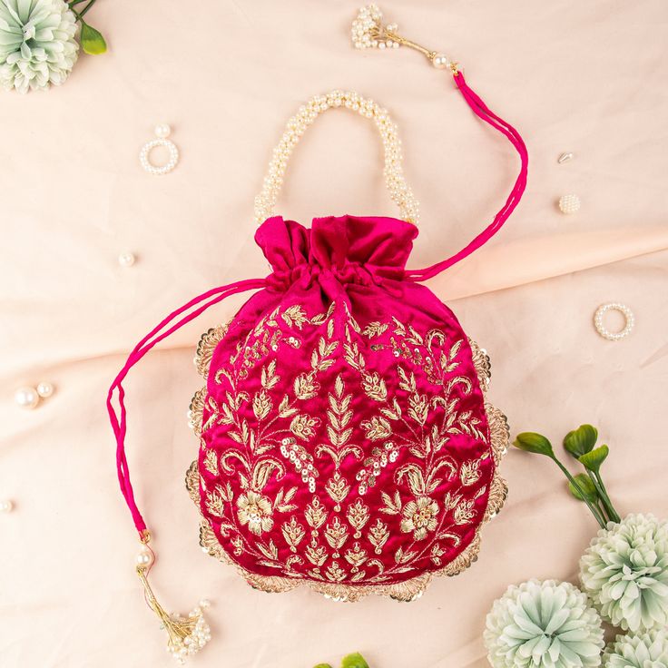 "Magenta Pink Luxury Velvet Fabric Zardozi Sequin Embroidered Woman Potli Bag | Bridesmaid Fashionable Gifting Bag | Velvet Drawstring Purse Package Contents: 1 Size: 10\" x 8\" Designed with the heart, this beautiful Potli or batawa bag are eye catchy and made of premium material. Key Features: Embroidery art work. (zardosi work). This potli is good match with both Indian and western outfits and are superb for wedding and festive parties. This would be best complement to your designer saree, lenhga or any other kind of dress. This is the combination of traditional and modern embroidery work. This is enough to keep your accessories and all needed essentials and it can be a best gift for any woman." Pink Handwork Pouch Bag, Red Floral Embroidery Bag For Festivals, Red Bags With Floral Embroidery For Festivals, Festive Pink Embroidered Shoulder Bag, Embroidered Festival Pouch, Embroidered Pouch For Festivals, Pink Embroidered Party Pouch, Party Pink Embroidered Pouch, Red Festive Pouch