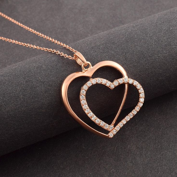 Express your love and connection with our Handmade Double Heart Pendant Necklace, featuring a diamond heart design and a rose gold plated chain. This exquisite piece is perfect for celebrating the special bond between a mother and daughter or for any occasion where you want to show someone how much they mean to you. Crafted with care, the 25mm heart pendant is made from high-quality alloy metal and adorned with a sparkling 2mm cubic zirconia (CZ) round stone. The rose gold plating adds a touch o Rose Gold Heart Pendant Jewelry In Cubic Zirconia, Rose Gold Cubic Zirconia Heart Pendant Jewelry, Mother's Day Rose Gold Heart Necklace With Cubic Zirconia, Rose Gold Heart Jewelry For Valentine's Day, Rose Gold Double Heart Cubic Zirconia Jewelry, Rose Gold Heart Pendant Necklace For Valentine's Day, Rose Gold Pendant Heart Necklace For Valentine's Day, Rose Gold Double Heart Jewelry For Valentine's Day, Rose Gold Heart Pendant Necklace For Mother's Day