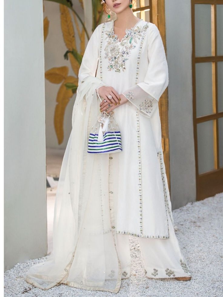 ✨This beautiful white silk long kurta has zari,beads and mirror work over the neck and sleeves and front pannel It has Palazzo pant with motifs and the bottom of the pant,it has orgenza dupatta with lace border and booties on the border of the dupatta. ✨Dazzle with this elegant outfit in any party or wedding function. ✨We stitched outfit with lot of care, so that our customers should not have any issues regarding finishing and fitting. ✨This dress can be customise in any other colour and in all Long Kameez, Designer Salwar, Embroidered Pants, Designer Salwar Suits, Wedding Function, Plus Size Designers, Salwar Suit, Star Dress, Pakistani Outfits