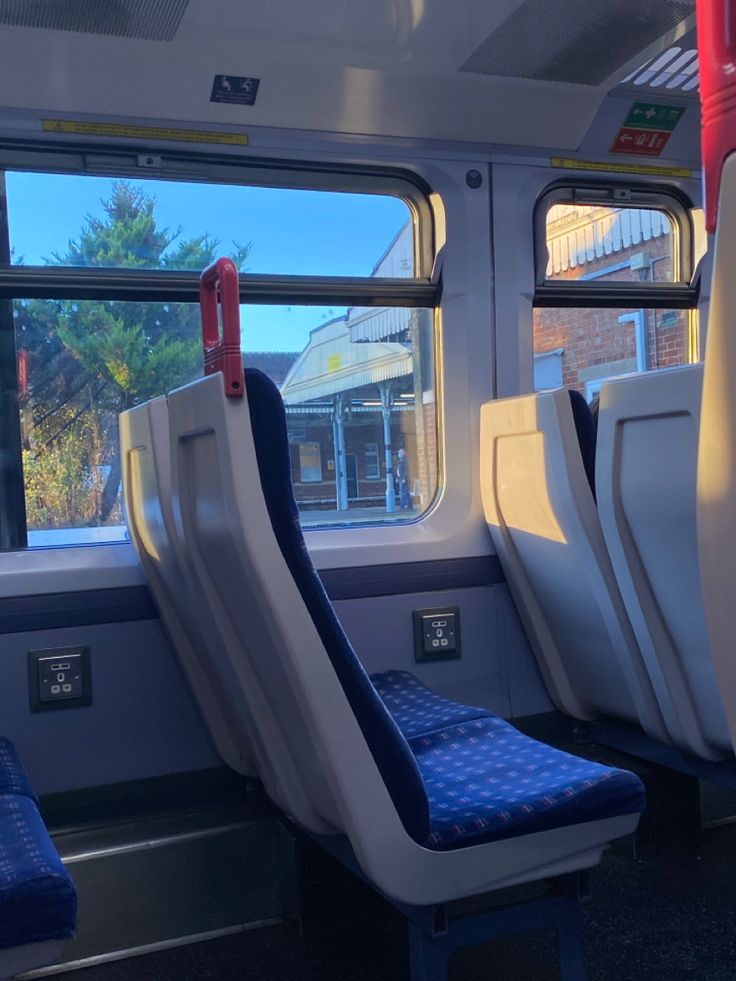 the seats are empty on the train and there is no one in them or they can be seen through the window