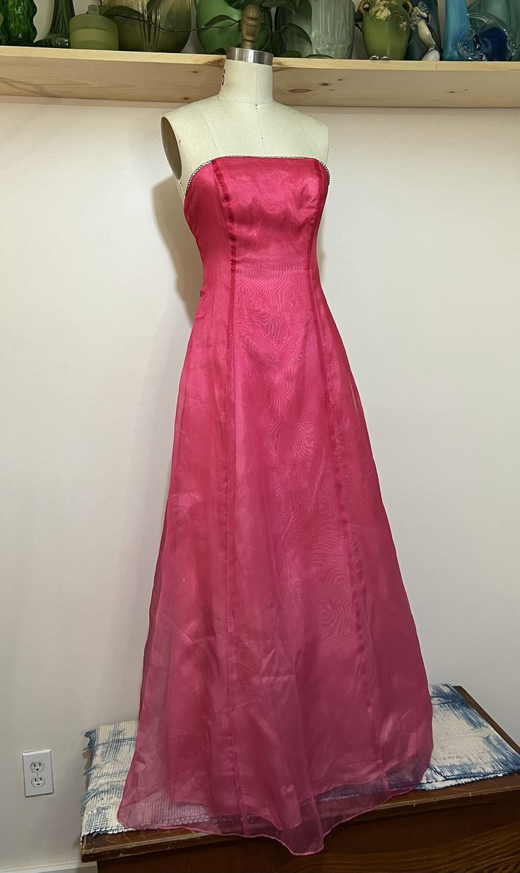 "Vintage 60s strawberry pink satin evening gown with rhinestone trim. Great colors/shape. Nice vintage condition with wear thats consistent with age. Please see photos for reference.   Pit to pit 14\" Waist 13.5\" Length 48\" Sweep 40\"" Pink A-line Evening Dress With Fitted Bodice, Pink Fitted A-line Gown, Spring Pink Evening Dress For Debutante Ball, Pink A-line Evening Dress For Prom, Pink Silk A-line Evening Dress, Pink Fitted A-line Evening Dress, Pink A-line Evening Dress For Formal Occasions, Pink A-line Gown With Fitted Bodice, Pink A-line Evening Gown