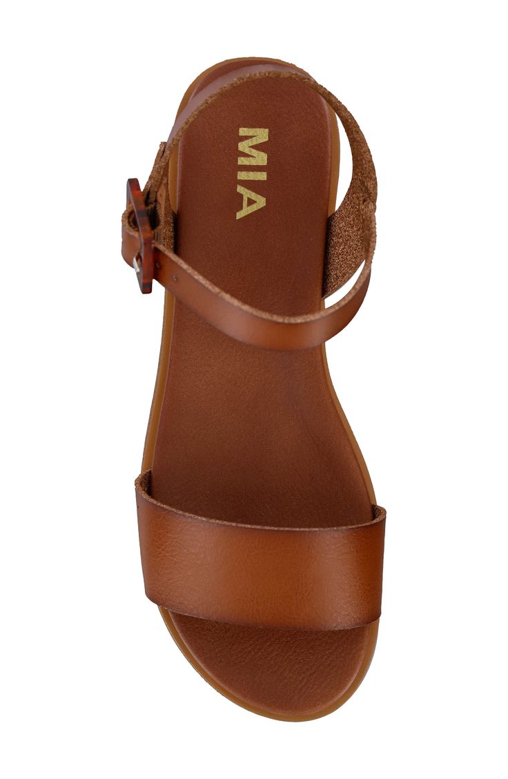 A geometric buckle lends visual intrigue to a minimalist sandal grounded by a contoured footbed for a custom fit. Adjustable ankle strap with buckle closure Contoured footbed Synthetic upper, lining and sole Imported Brown Sandals With Heel And Ankle Strap, Wedge Heel Sandals With Buckle Closure, Synthetic Ankle Strap Footbed Sandals With Buckle Closure, Brown Adjustable Heel Strap Sandals, Brown Adjustable Sandals With Heel Strap, Adjustable Brown Sandals With Heel Strap, Brown Ankle Strap Sandals With Buckle, Brown Ankle Strap Sandals With Buckle Closure, Synthetic Footbed Sandals With Ankle And Heel Straps