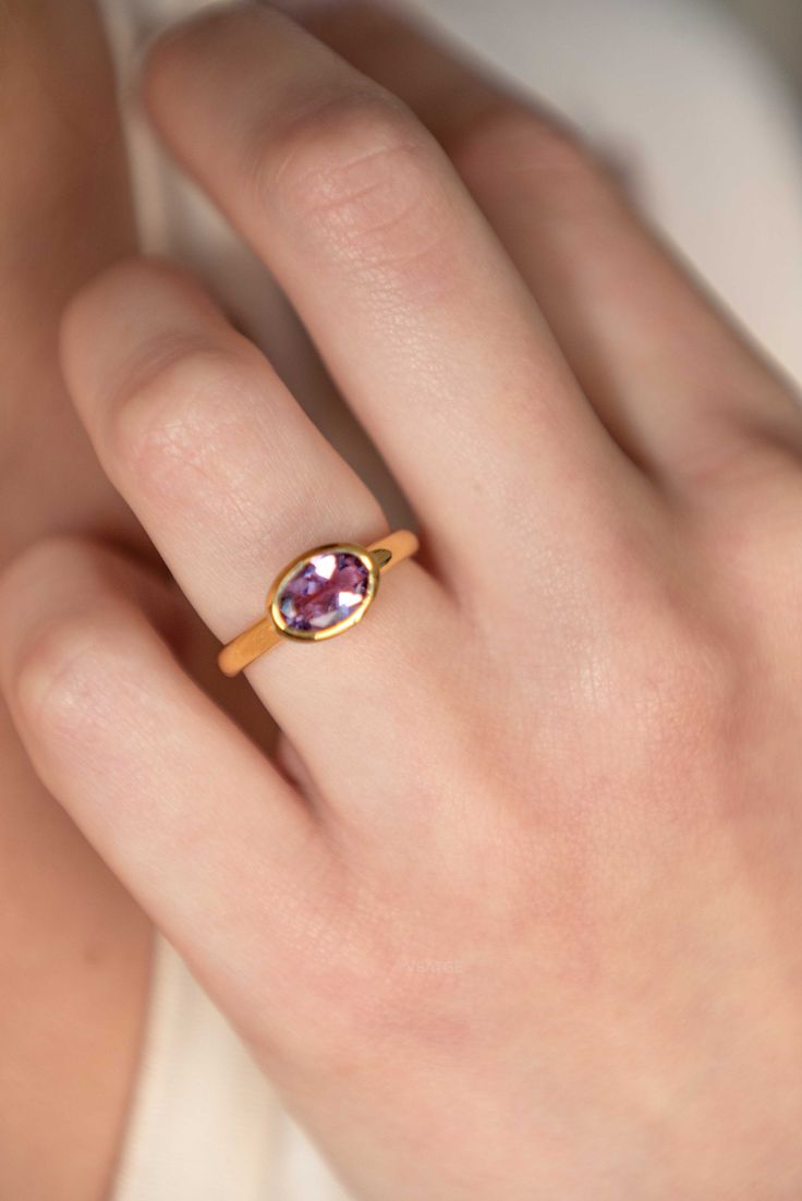 Our Purple Amethyst Ring is handmade with genuine faceted gemstone in an oval shape in 18k gold vermeil over 925 sterling silver. An everyday classic ring with a touch of modern, you will never regret investing in or gifting to your loved ones. Securely set in our sleek and sturdy bezel setting. D E T A I L S * Dimensions - Oval - 11mm x 8mm, stone - 9m x 6mm * Band - 3mm to 2mm * Material: 18k gold vermeil over 925 sterling silver, genuine Amethyst gemstone * See 'Gemstone Rings' tab for more S Everyday Oval Bezel Set Jewelry, Timeless Oval Cabochon Sapphire Ring Gift, Classic Everyday Stackable Gemstone Rings, Everyday Oval Stackable Rings With Birthstone, Timeless Sapphire Gemstone Ring As A Gift, Modern Oval Birthstone Ring With Gemstone, Timeless Birthstone Ring For Gifts, Modern Amethyst Ring As Gift, Timeless Stackable Rings With Birthstone As Gift