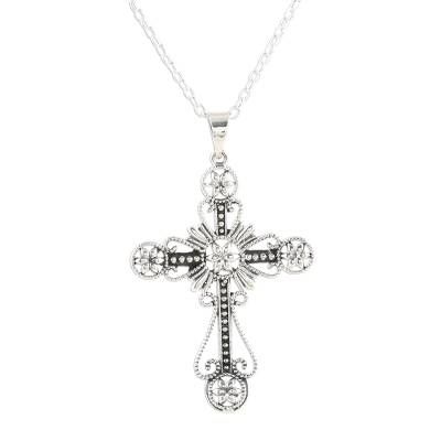 Decorated with flowers and looping designs a majestic cross is crafted from sterling silver accentuated by a combination between high-polish and oxidized finishes. India's Shivany Choudhary designs this faithful pendant necklace. Spiritual Silver Cross Necklace With Oxidized Finish, Elegant Sterling Silver Nickel-free Cross Necklace, Nickel-free Sterling Silver Elegant Cross Necklace, Elegant Nickel-free Silver Cross Necklace, Elegant Silver Nickel-free Cross Necklace, Antique Silver Spiritual Cross Pendant Jewelry, Antique Silver Cross Necklace Spiritual Style, Ornate Silver Cross Jewelry, Ornate Sterling Silver Cross Jewelry