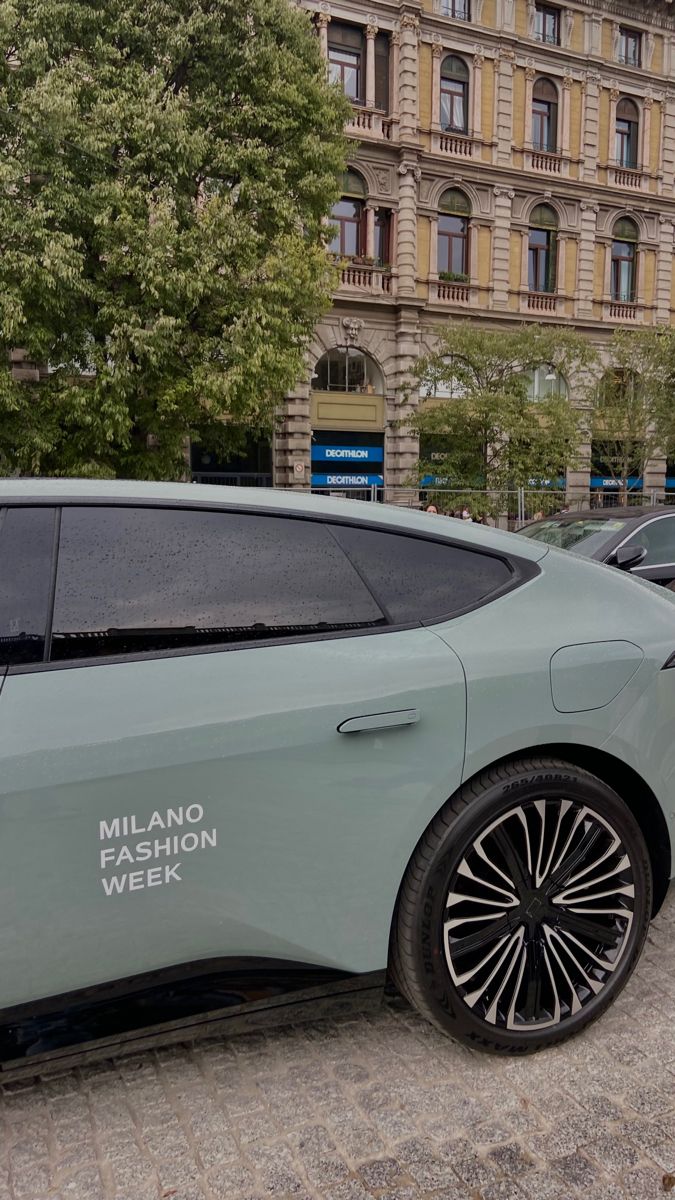 two electric cars parked in front of a building