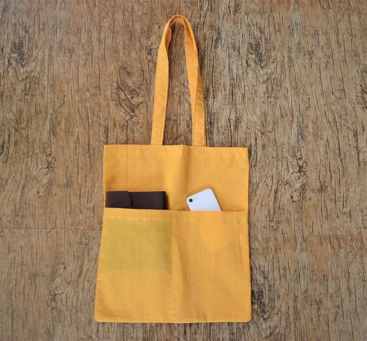 Yellow Bag With Pockets Tote bag (unisex) Handmade Measurement in Inches Length- 16" Width- 14" Handle- 13" (From shoulder tip to middle) Multipurpose Bag A nice special gift inside every order. We provide special occasion custom bags, message for the same. And, we do cater to bulk orders, message for the same too. Square Canvas School Bag With Pockets, Eco-friendly Rectangular Shoulder Bag For School, Eco-friendly Canvas School Bag, Eco-friendly Rectangular Canvas School Bag, Yellow Canvas Bag With Pockets, Square Canvas Bag With Pockets For Daily Use, Yellow Canvas Bag With Large Capacity For Daily Use, Yellow Canvas Bag With Pockets For Daily Use, Yellow Canvas Bag With Pockets For School