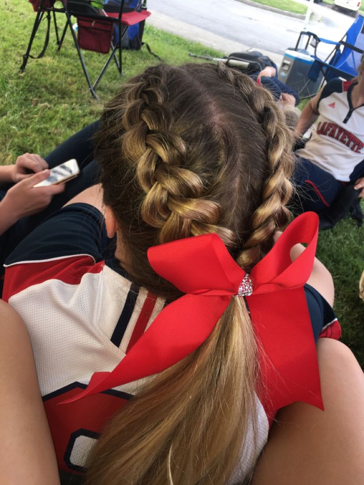 Two dutch braids meet into a pony tail Braided Cheer Hair, Cute Cheer Hairstyles With Bow, Cute Cheer Hairstyles, Cheer Ponytail, Soccer Hairstyles, Tail Hairstyle, Gymnastics Hair, Softball Hairstyles, Cheerleading Hairstyles