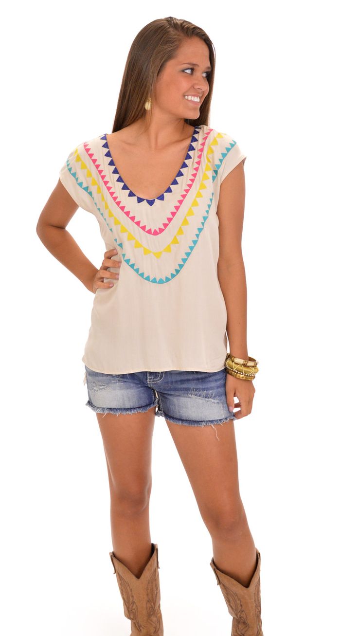 Angie Top, Multi Embroidered V-neck Top For Day Out, V-neck Top For Summer Outings, White Cotton Tops For Summer Outings, Summer V-neck Top With Geometric Embroidery, V-neck Tops With Floral Embroidery For Vacation, Casual V-neck Blouse With Geometric Embroidery, V-neck Tops With Floral Embroidery For Day Out, Trendy Floral Embroidery Tops For Beach, Trendy Embroidered V-neck Tops