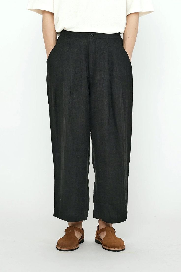 FINAL SALE Please note that this is a Final Sale item. No returns or exchanges will be accepted. Linen Pleated Trousers in Black from 7115 by Szeki. A summer edition of the uniform pants, the Pleated Trouser. Button and fly fastening with elasticized back waistband. Side and back pockets. Crafted out of a soft, breathable, moisture wicking linen. Sizing + Details → Made In Guangzhou City, China 100% Linen Sewn-Down Double Pleat At Front High Waisted, Relaxed Loose Fit Ananda Stands 5'7" And Wear Uniform Pants, Pleated Trousers, Bandana Scarf, Guangzhou, Jumpsuit Dress, Moisture Wicking, Final Sale, Shopping Outfit, Loose Fitting