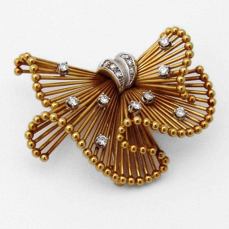 "Retro brooch in form of a folded ribbon, made of 18 K (.750) yellow and white gold, accented with Diamonds - 0.5 approx. total carat weight, G / VS. This splendid brooch is 1 3/4\" long, 1 3/8\" wide and weighs 17.8 grams. EA988" African Inspired Earrings, Ribbon Brooch, Ribbon Jewelry, Starfish Necklace, Antique Show, Classy Jewelry, Selling Jewelry, Vintage Watches, White Gold Diamonds