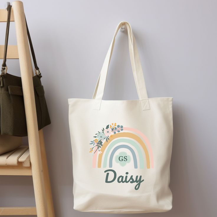 "Show off your Girl Scout Pride with this 100% cotton bag that comes in one size - 15\" x 16\"- perfect for everyday wear. While the canvas material is durable and will last for years. The bag features 20\" handles (made from the same canvas), making it easy to carry even with a week's worth of shopping. .: 100% cotton canvas .: Heavy fabric (12 oz/yd² (406.9 g/m" Trendy Cream Cotton Canvas Bag, Trendy Cotton School Bag, Casual Cream Cotton Canvas Bag, Cream Cotton Shoulder Bag For Daily Use, Cream Cotton Canvas Bag For Everyday Use, Cream Cotton Shoulder Bag With Canvas Lining, Everyday Cream Cotton Shoulder Bag, School Shoulder Bag With Letter Print In Cotton, White Eco-friendly Canvas Bag For School