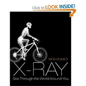 a skeleton riding a bike with the words x - ray on it