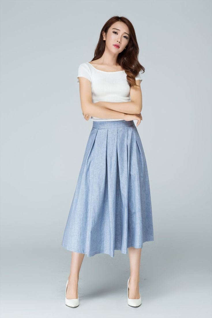 "Spring has sprung in this blue midi skirt from Xiaolizi. The linen skirt built in a high-rise, A-line silhouette with pleating throughout. The summer circle skirt topped with a banded waist + two seam pockets. DETAIL * 50% linen, 50% cotton * No lining * Seam pocket * Back zipper closure * Below Knee Length * Pleated Skirt * Perfect for summer, spring * Wash by hand or machine with cold water * The model is 163cm (5′4″) tall with a 80cm (31.5\") bust, 66cm (26\") waist. She is wearing the blue Pleated Long Skirt For Summer, Casual Pleated Midi Bottoms, Pleated Flared Skirt For Summer, Pleated Waist Flared Summer Skirt, Summer Cotton Pleated Midi Skirt, Spring Pleated Wide Leg Culottes, Spring Midi Skirt With Pockets, Spring Pleated Wide-leg Skirt, Spring Wide Leg Pleated Culottes