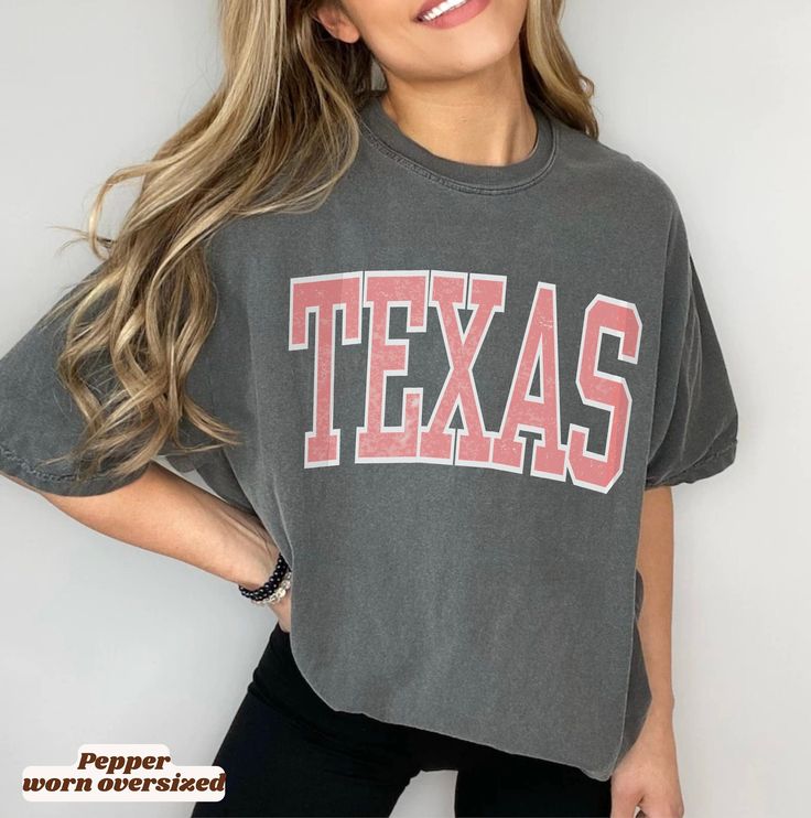 Retro Texas *Comfort Colors T-shirt. The divine *Comfort Colors T-shirts are made from specially spun fibers of 100% cotton for strength and softness and are pre-washed for that relaxed look and feel we love. 🌸 Please refer to the size chart in the listing images before submitting your order For oversized look, size up 1-3 from your regular size, depending on the look desired. *Compared with other shirt brands, Comfort Colors are generally thicker and have a larger fit. So keep in mind when you Oversized Fan Apparel Tops For Game Day, Collegiate Oversized Top With Graphic Print, Oversized Collegiate Top With Graphic Print, Oversized Letter Print Tops For Game Day, Oversized Collegiate Cotton Top, Oversized Cotton Collegiate Top, Oversized School Spirit T-shirt With Letter Print, Oversized Graphic Tee For College, Oversized Varsity Crew Neck Top