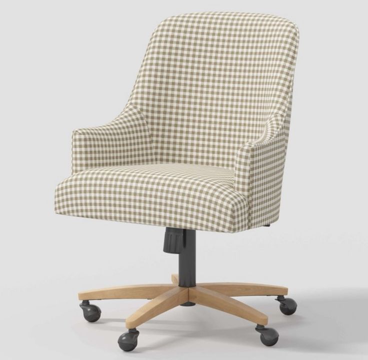 an office chair with wheels and a checkered fabric upholstered on the back