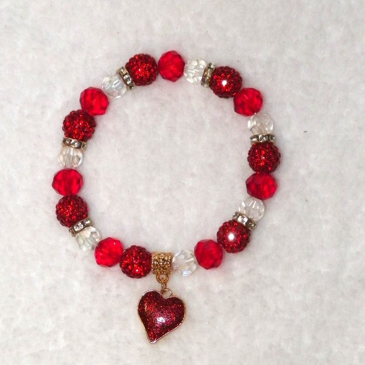 ~Pretty Heart Charm Beaded Stretch Bracelet ~Round Crystal & Red Faceted Glass Beads With Round Red Crystal Rhinestone Beads ~Accented With Gold Metal & Crystal Rhinestone Rondelle Spacers ~Decorative Gold Charm Bale With 5/8" Sparkling Red Glitter Heart Charm ~Perfect For Valentine's Day, Wedding Or Special Occasion ~General Cleaning Instructions: Wipe With A Damp Cloth, Dry With A Soft Cloth. Do Not Immerse In Water Or Jewelry Cleaner. ~Thank You For Your Interest In This Item! ~Please Shop Al Red Heart-shaped Bracelets For Valentine's Day, Handmade Heart Bracelet For Valentine's Day, Valentine's Day Gift Crystal Bracelet With Heart Beads, Red Adjustable Crystal Bracelet For Valentine's Day, Adjustable Red Crystal Bracelet For Valentine's Day, Adjustable Red Heart Bracelet For Party, Red Heart Bracelet For Party, Valentine's Day Heart Beads Charm Bracelet For Party, Valentine's Day Party Charm Bracelet With Heart Beads