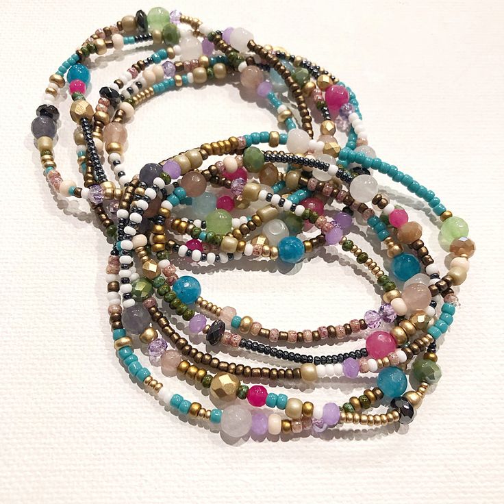 🌙 SPECIAL PRICING - only 1 available 🌙 Bohemian Summer ~ all the colors to give you a cool vibe for work or play. Have fun wearing this beautiful piece wherever you go! I mixed delicate beads in turquoise, gold, white, bronze, beige and gunmetal. Then added accents of agate and faceted crystals in various colors with hematite throughout. Bracelet measures 38" and wraps 5 times around a 7 1/2" wrist. It can also be worn as a necklace, wrapping approx. 2 times around your neck for a layered look Multicolor Multi-strand Spiritual Beaded Bracelets, Multicolor Beaded Multi-strand Wrap Bracelet, Multicolor Multi-strand Wrap Bracelet With Colorful Beads, Multicolor Multi-strand Beaded Bracelets For Beach, Multicolor Hand-strung Wrap Bracelet For The Beach, Multicolor Multi-strand Hand-strung Bracelets, Bohemian Multicolor Gemstone Beaded Bracelets, Multicolor Gemstone Beaded Bracelets For Festivals, Bohemian Multi-strand Purple Beaded Bracelets