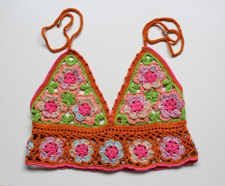 Handmade crochet top special edition unique design orange floral Anni & Amie Available in UK 10 to buy now. See below on how to preorder if you would like a different size: We're a UK brand that specialise in handmade clothing. All our items are created by Anne Lee, with help from Amy. Our styles reflect hippie/bohemian fashion and we like to mix bright colours and patterns to create one of a kind items.  Every item is slightly different and unique, all handmade personally for you with love. This means we only sell in limited quantities and not every size/style is listed. If you are interested in an item and would like to pre-order this in your size, please send us a message. Please check out our other items x Orange Summer Crochet Top, Handmade Vintage Tops For Summer, Vintage Handmade Tops For Summer, Handmade Vintage Summer Tops, Summer Orange Crochet Top, Sleeveless Granny Square Tops For Spring, Spring Fitted Orange Crochet Top, Fitted Orange Crochet Top For Spring, Spring Orange Fitted Crochet Top