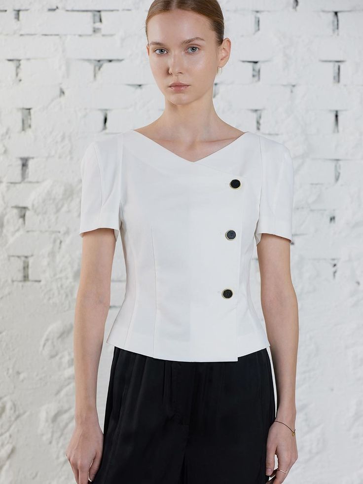 Editor's Notes Soft and structured  this slim fitting blouse has feminine wrap style front with shiny button fastenings. Fitted waist accentuates the refined  sophisticated mood. - Lightweight cotton blend fabric- Feminine boat neck design- Double breasted button fastenings- Tucked waist for slim fit* Packaged with sustainable  biodegradable fabric Measurements(in.)Size (01_S/02_M)- Length: 18.46 in / 18.70 in - Bust: 19.17 in / 20.16 in - Sleeve: 10.24 in / 10.47 in&nbs Elegant Tailored V-neck Top, Elegant V-neck Wrap Top For Work, Modern Tailored Semi-formal Tops, Modern Tailored Top For Semi-formal Occasions, Fitted V-neck Blouse With Buttons, Elegant V-neck Top For Business Casual, Sleek Fitted Blouse With Button Closure, Fitted V-neck Wrap Top For Work, Modern V-neck Blouse For Formal Occasions