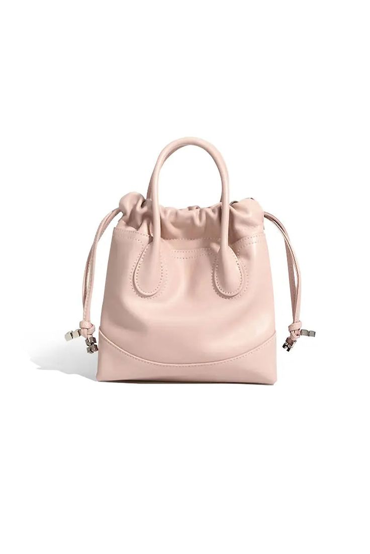 Perfectly Crafted Leather Mini Tote for Every Occasion Introducing our 2024 Leather Mini Tote Bag, crafted from premium calfskin in a soft pink hue. This stylish bag features sturdy top handles and an adjustable shoulder strap, offering versatile carrying options. The unique drawstring design enhances security while adding a playful touch. Perfect for daily commutes and casual outings. Style #: WWAJ804 Leather Bucket Bag With Top Carry Handle, Pink Leather Bag For Daily Use, Pink Leather Bucket Bag For Daily Use, Leather Satchel With Handles, Modern Pink Satchel With Handle Drop, Versatile Pink Leather Bag, Trendy Pink Leather Satchel, Modern Blush Bag For Everyday Use, Luxury Pink Bucket Bag With Top Carry Handle