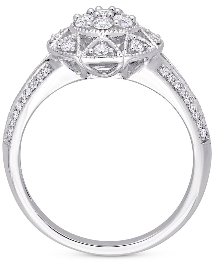 Detailed milgrain beading adds to the romantic vintage feel of this elegant diamond cluster engagement ring. Macy's White Gold Diamond Ring For Anniversary, Macy's White Gold Diamond Anniversary Ring, Macy's Promise Ring With Diamond Cut, Classic White Gold Rings From Macy's, Macy's Diamond Cut Promise Ring, Macy's White Gold Diamond Ring Brilliant Cut, Macy's Diamond White Promise Ring, Macy's Classic Rings With Diamond Accents, Macy's Brilliant Cut White Gold Diamond Ring