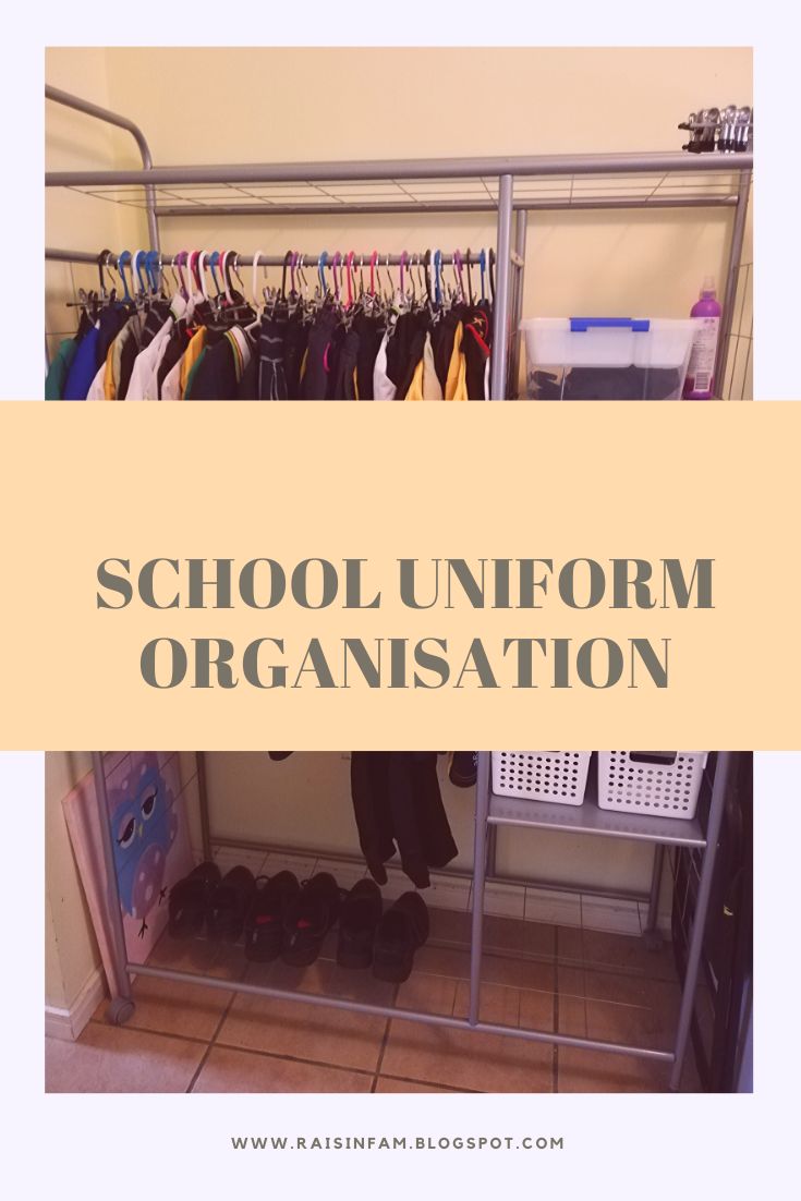 a rack with shoes and umbrellas on it in front of a door that says school uniform organization