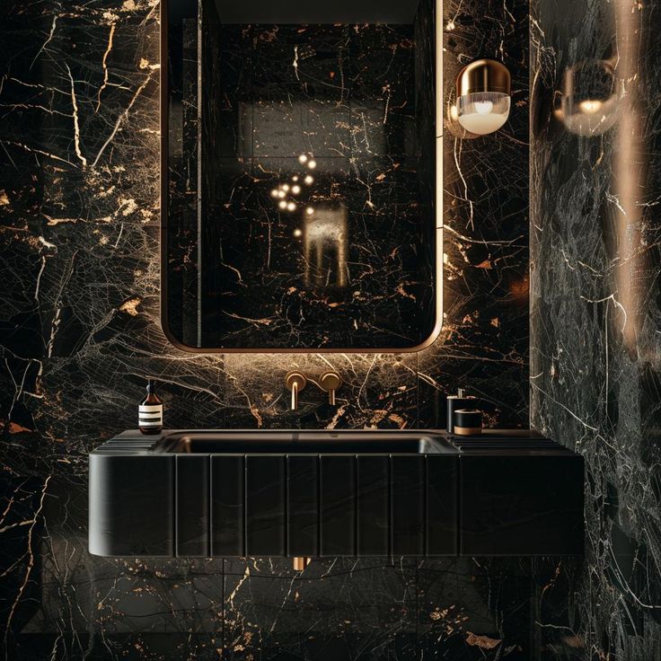 a bathroom with black marble walls and flooring, along with a sink in the middle