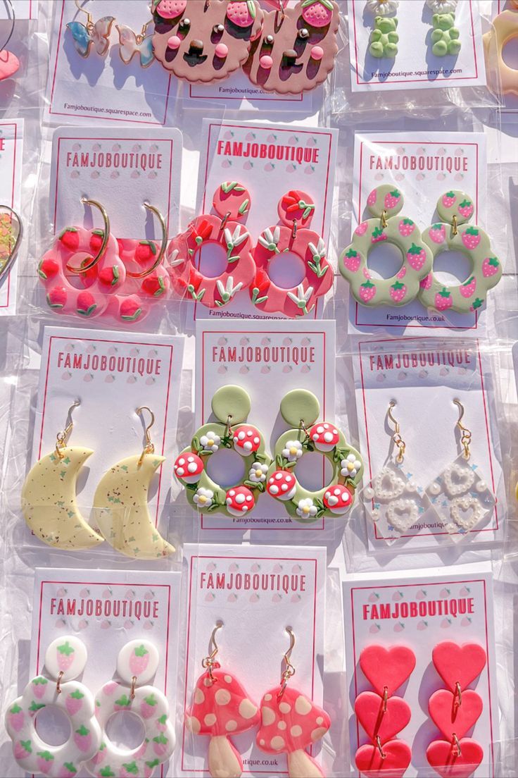 there are many different types of earrings on display