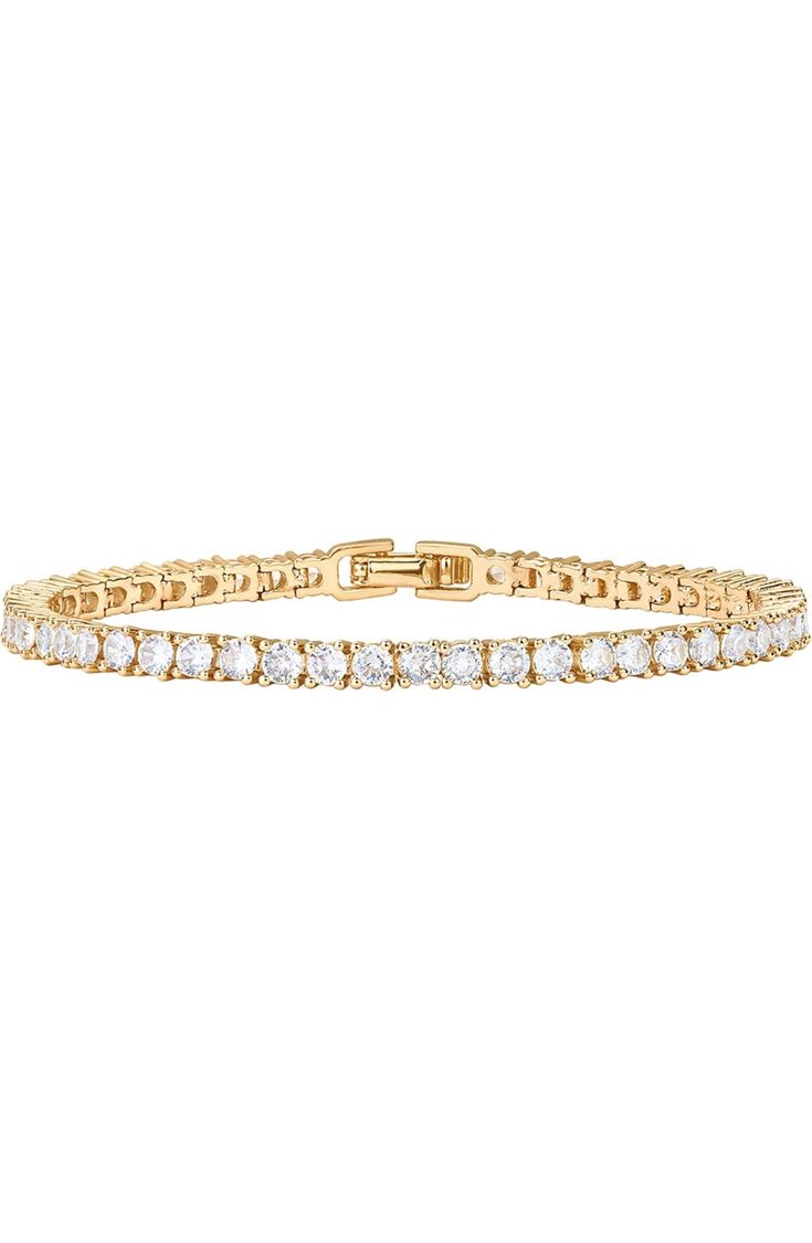 Description The ultimate classic. This timeless, beautiful, elevated tennis bracelet is a necessity for every woman's jewelry box. The perfect statement bracelet that can be worn every day or stacked with other pieces. Materials 14K yellow gold, rose gold or white gold plated AAAAA Cubic Zirconia Stone size: 3mm Sizes: 6.5"; 7"; 7.5" Hypoallergenic; nickel, lead, and cadmium free Tennis Bracelet Gold, Dainty Wedding, Gold Bracelet For Women, Gold Bracelets, Elegant Bracelet, Stackable Bracelets, Rose Gold Bracelet, Watches Women Fashion, Statement Bracelet