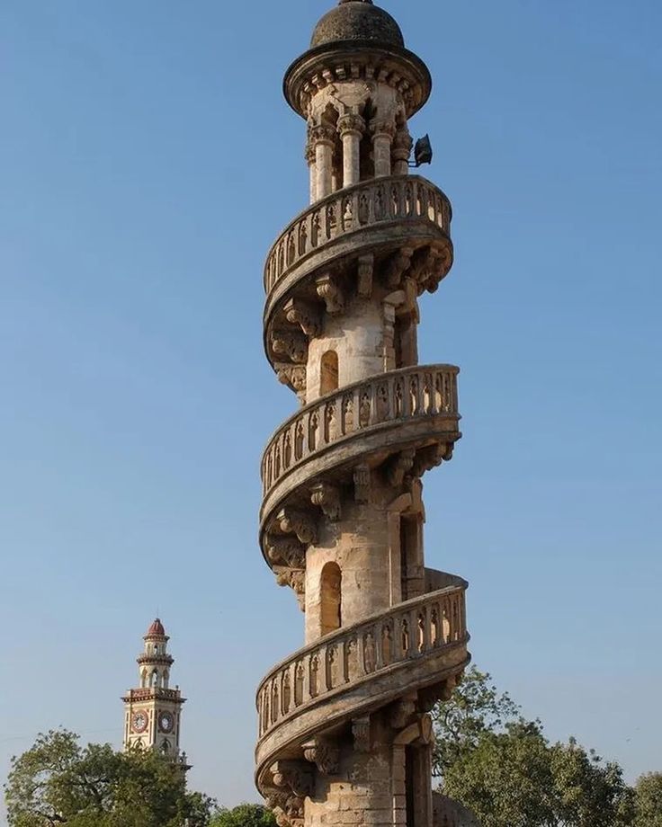 a tall tower with many balconies on top