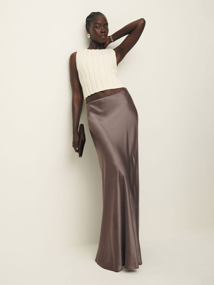 For it girls, by an it girl. Shop the Lakisha Skirt from Reformation, a full-length skirt with a mid rise. Chic Silk Voluminous Maxi Skirt, Chic Full Maxi Skirt For Night Out, Chic Voluminous Silk Maxi Skirt, Chic Evening Full-length Skirt, Chic Full-length Relaxed Skirt, Satin Skirt Outfit, Laura Harrier, Waterfall Skirt, Charmeuse Fabric