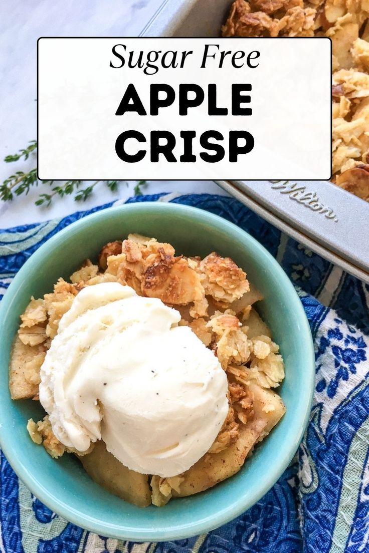 a blue bowl filled with apple crisp and topped with ice cream