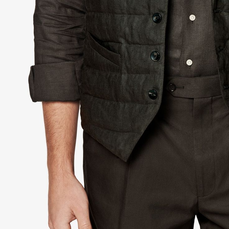 As an in-between layer or over a shirt, this dark brown padded vest is a versatile, trans-seasonal layering piece that effortlessly adds depth and casual appeal to any look. Business Vest With Welt Pockets For Fall, Winter Business Casual Vest With Pockets, Business Casual Winter Vest With Pockets, Casual Business Vest Outerwear, Casual Business Vest With Pockets, Tailored Sleeveless Brown Outerwear, Tailored Brown Vest With Pockets, Tailored Casual Vest For Fall, Casual Tailored Winter Vest