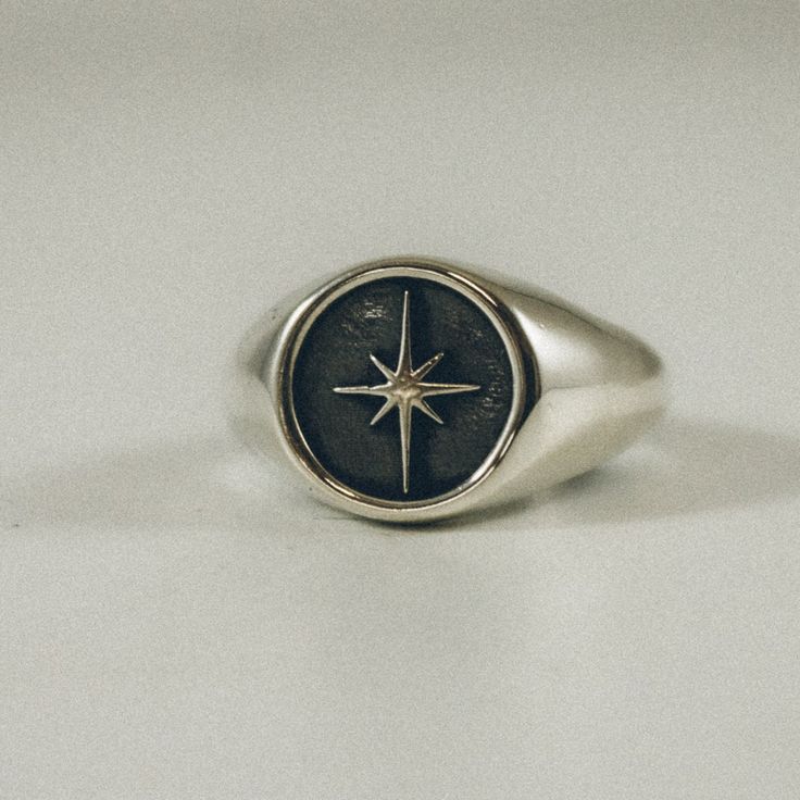 A solid North Star signet ring. This celestial piece of handcrafted jewelry is made with 925 recycled silver and is perfect for your everyday stack of adornments. -------- The Grit Trade Co. collection is small-batch / woman-made in Nashville, TN. Using the investment casting method, each piece is 3D printed, cleaned, sprued, poured, burned out, cast in recycled sterling silver, sanded, polished and tumbled twice. You'll find a .925 sterling silver stamp and GRIT makers mark on each piece. *Plea Celestial Ring, Mens Rings Fashion, Signet Rings, Silver Signet Ring, Dope Jewelry, Jewelry Lookbook, Funky Jewelry, Ring Minimalist, Star Ring