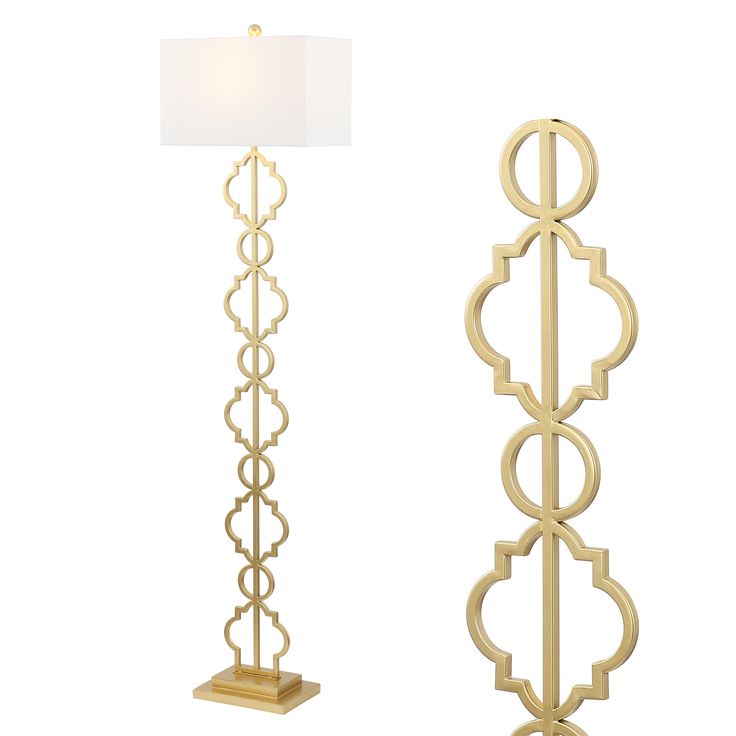 a tall lamp with a white shade on top and a gold floor lamp next to it