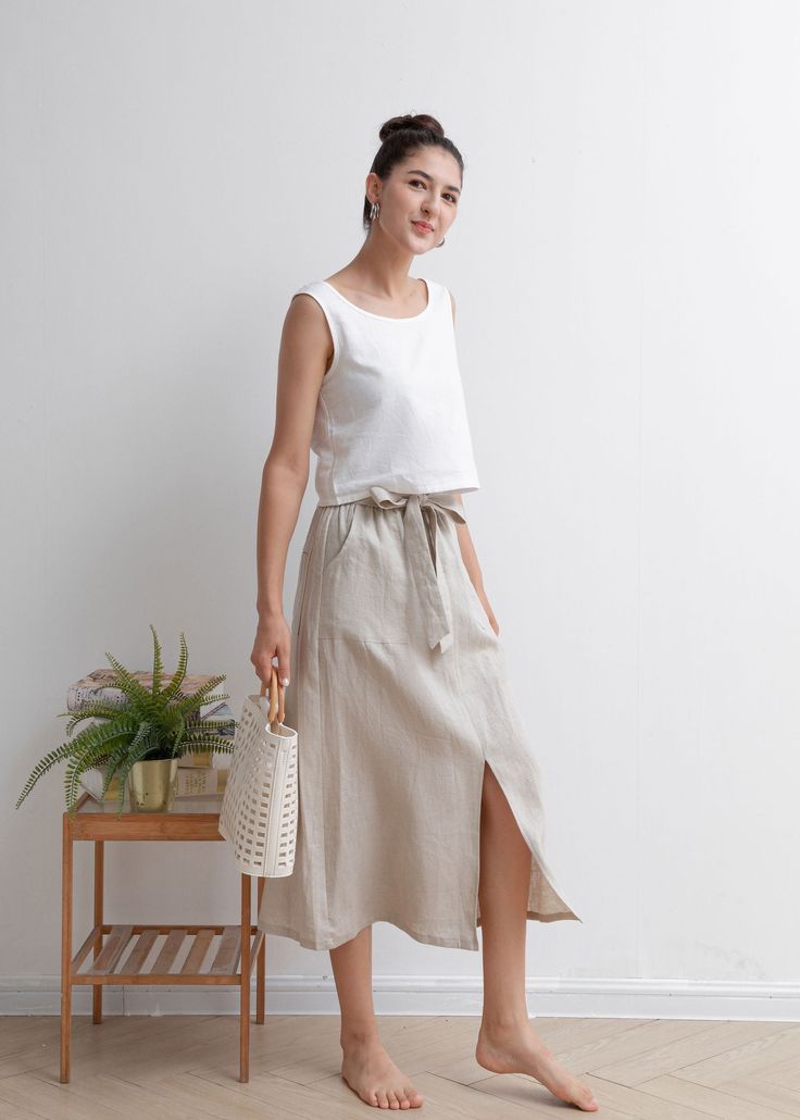 "★★FEATURES 100% Linen Front two pockets Elastic waist skirt Belt skirt Pleated waist details Front split skirt Casual skirt Perfect for Summer, Spring, Autumn ★★ Model Size Height approx 162 cm (5′ 4″) Bust 84 cm (33\") Waist 66 cm (26\") She wears size XS. ★★ Bespoke Order Service If you Request other color Request the length Your height is not between 155 cm- 172 cm Your weight is over 75 kg I can do it for you, It will need some extra fee depending on on your need. Contact with me for more d Casual High-waisted Skirt With Tie Waist, Casual High Waist Skirt With Tie Waist, Casual High Waist Skirt With Tie, Casual Tie Waist Mini Wrap Skirt, Casual Long Skirt With Tie Waist, Relaxed Fit Tie Waist Flared Skirt, Long Relaxed Skirt With Tie Waist, Relaxed Fit Tie-waist Flared Skirt, Relaxed Fit Flared Skirt With Tie Waist